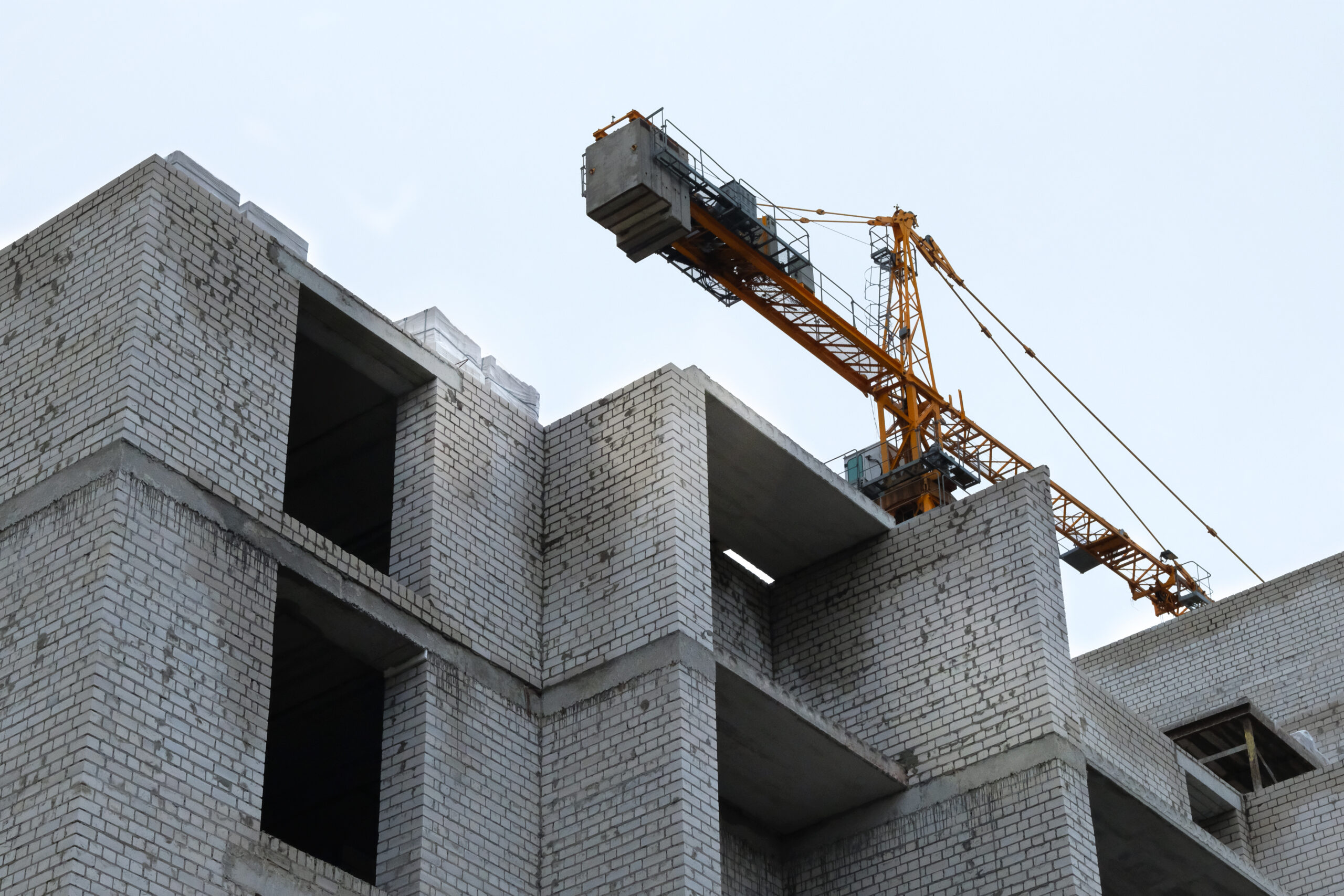 Building and Construction site of new home. New house under construction. House under construction at building site.